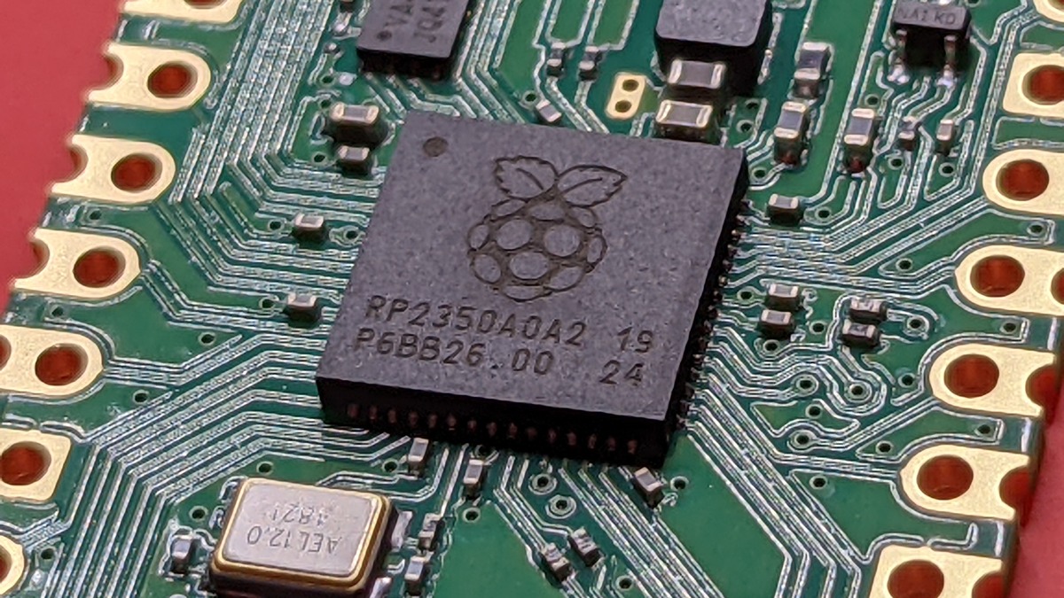Macro view of high-efficiency on-device AI microcontroller and audio DSP architecture on circuit board